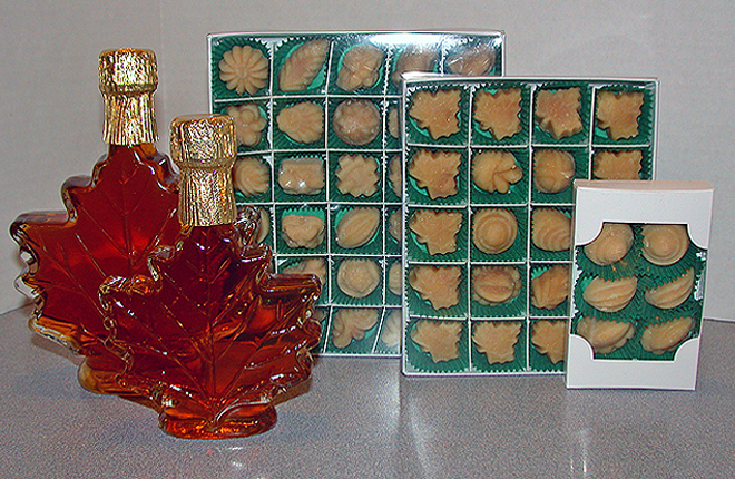 Maple syrup in glass maple leaf bottles, maple candy